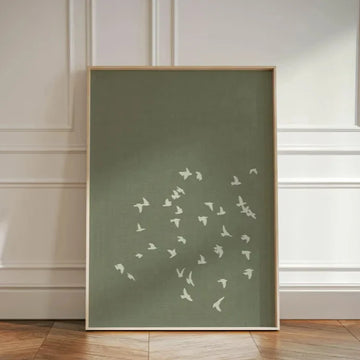 toile art minimaliste oiseaux blancs volants vert olive cadre bois décoration salon