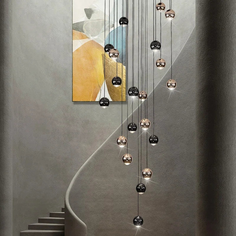 suspension lumineuse contemporaine noir doré sphères métalliques brillantes éclairage intérieur maison
