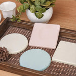 supports verre adhésifs tapis diatomées rond carré gris rose bleu texture granuleuse minimaliste maison