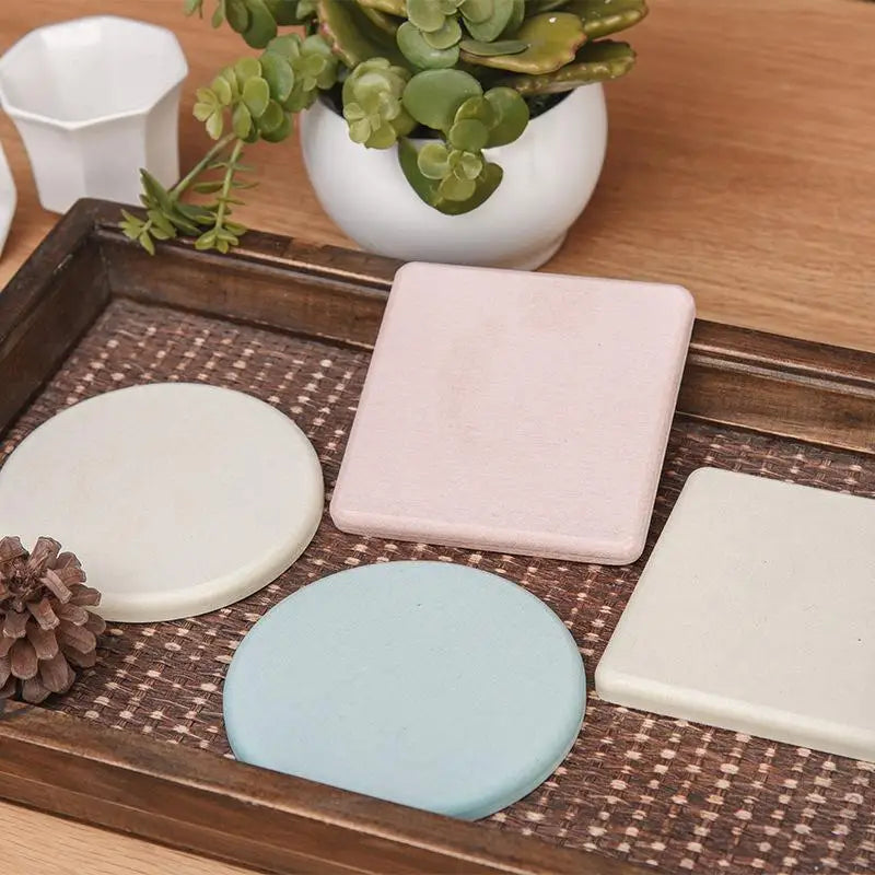 supports verre adhésifs tapis diatomées rond carré gris rose bleu texture granuleuse minimaliste maison