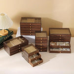 boîtes bijoux marron foncé texture bois moderne poignées dorées compartiments multiples rangement bijoux