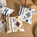 housse coussin carré boho chic motifs géométriques pompons couleur neutres décor maison