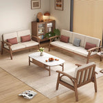 canapé places scandinave beige clair fauteuil pied poule moderne tapis géométrique terracotta blanc