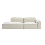 canapé d'angle moderne beige clair uni confortable salon minimaliste inclusion coussins tapis