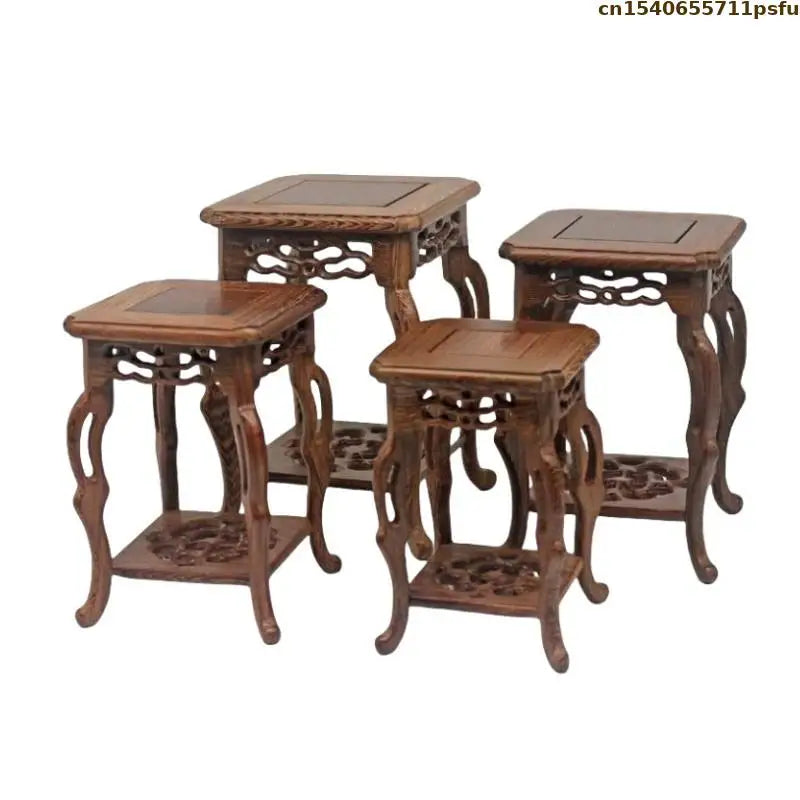 table basse bois rose classique gravures artisanal marron clair pot plante figurine cadre photo