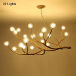 suspension lumineuse moderne branches naturelles sphères translucides marron clair blanc
