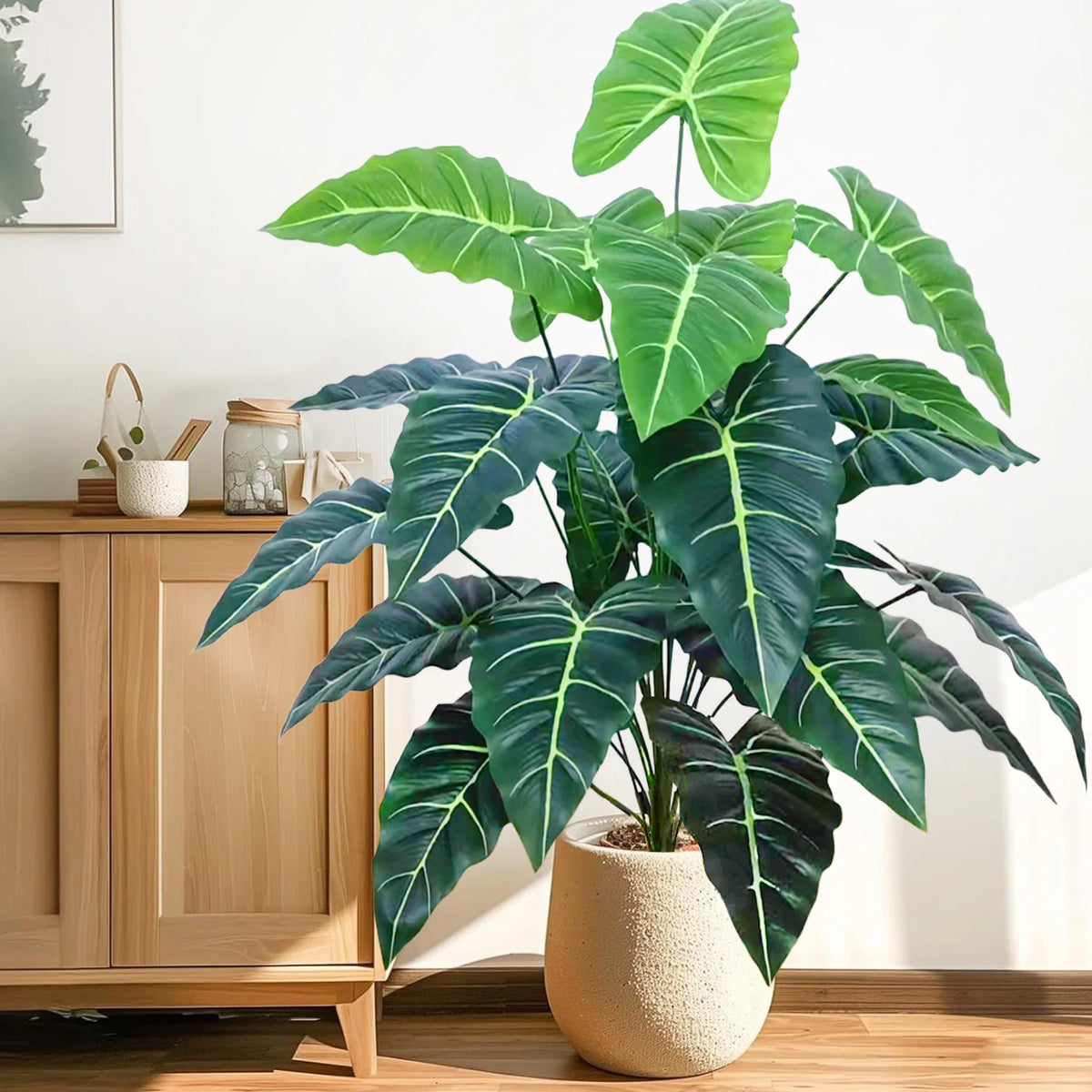 plante artificielle moderne arbre monstera feuilles vertes decoration intérieure pot blanc contemporain exposition maison
