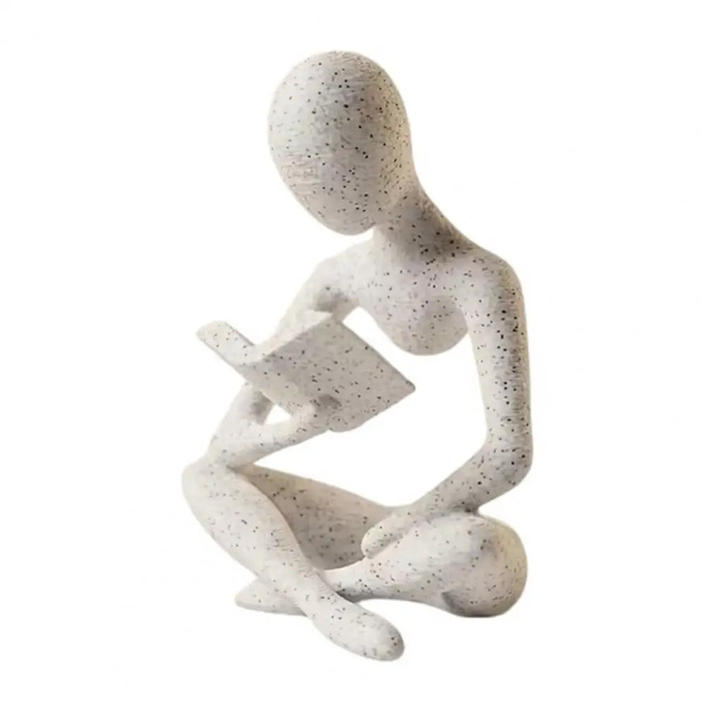statue décorative moderne figure humaine assise livre blanc noir texturée minimaliste éléments