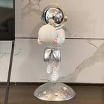 statuette astronaute résine couleur changeante doré argenté rose jaune moderne brillant métallique fixations