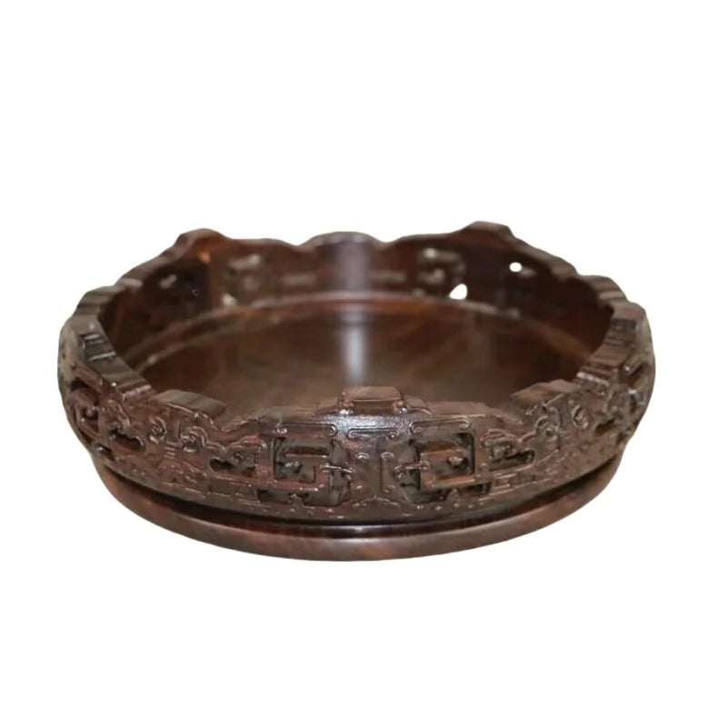 support circulaire bois sculpté artisanal traditionnel marron foncé détails complexes vase plantes décoration maison