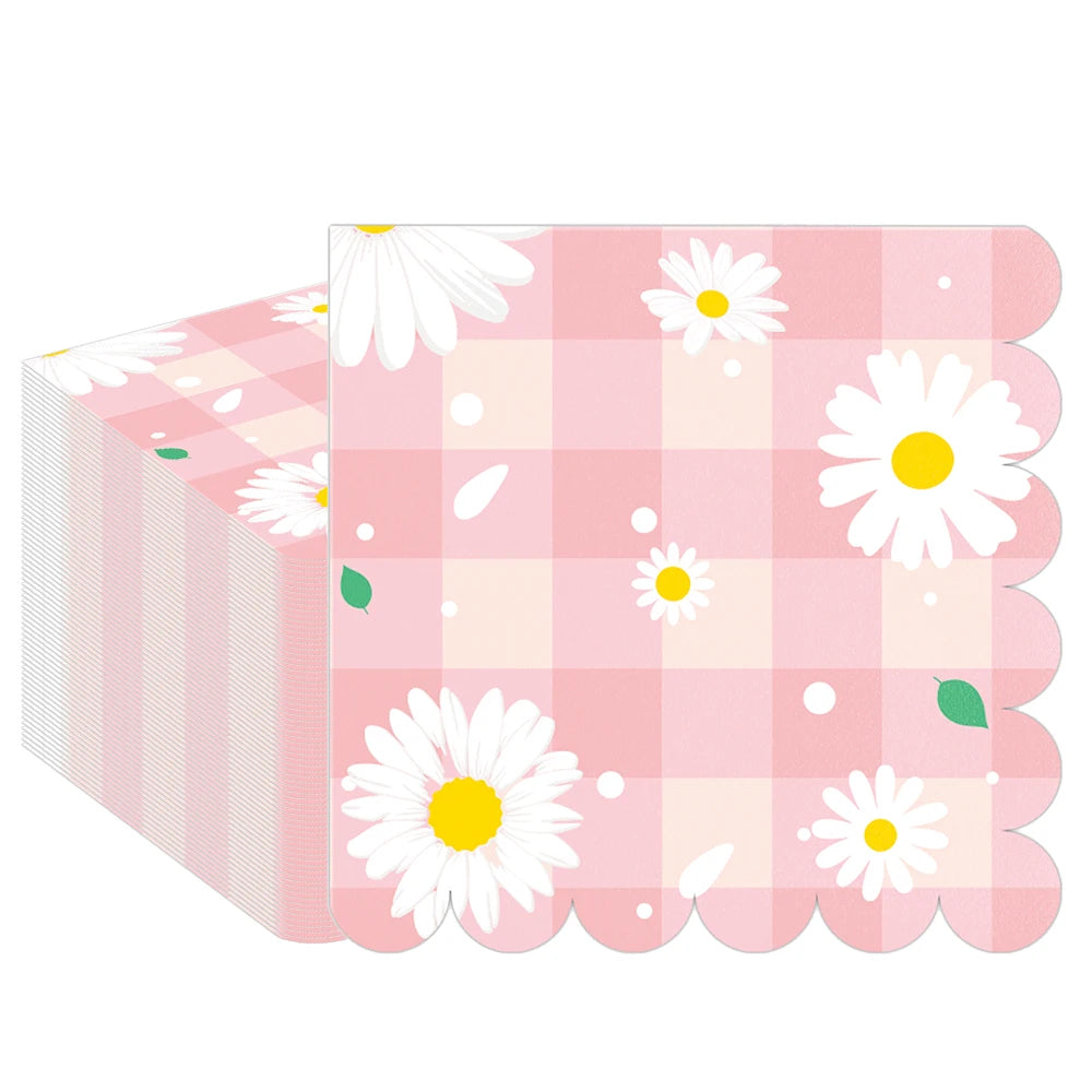 serviettes papier festives fleur blanche carreaux motif géométrique rose clair pliées dépliées jetables anniversaire