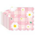 serviettes papier festives fleur blanche carreaux motif géométrique rose clair pliées dépliées jetables anniversaire