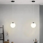 suspension lumineuse moderne sphérique verre opale noir blanc doré minimaliste