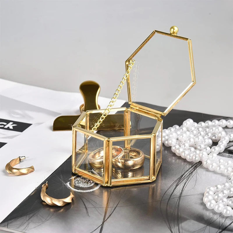 boîte bijoux hexagonale or transparente blanches bagues boucles dorees élégante coffret cadeau verre moderne