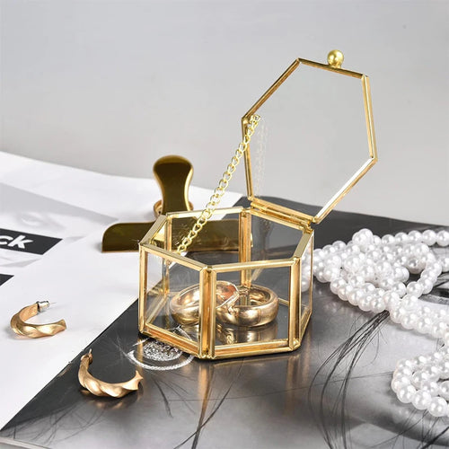 boîte bijoux hexagonale or transparente blanches bagues boucles dorees élégante coffret cadeau verre moderne