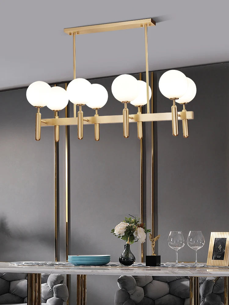 suspension lumineuse moderne or noir sphères translucides métal poli élégante led chambre salon
