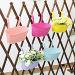 paniers suspendus modernes couleurs vives rose violet vert bleu jaune minimaliste balcon patio jardin