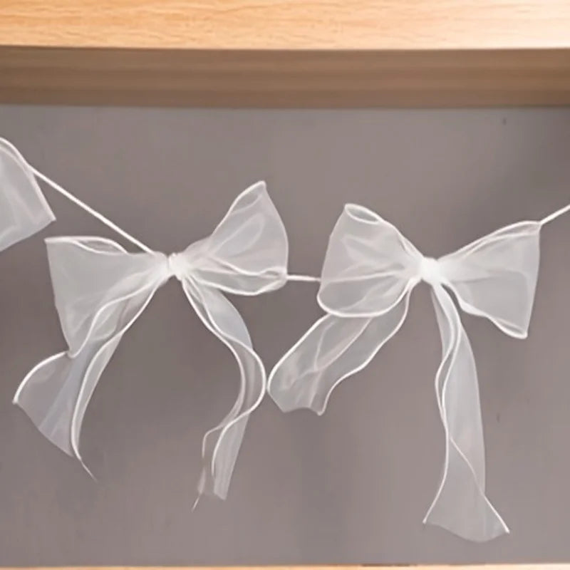 guirlande décorative festives rose noeuds tissu texturé semi transparent mariage anniversaire fille préparation naissance