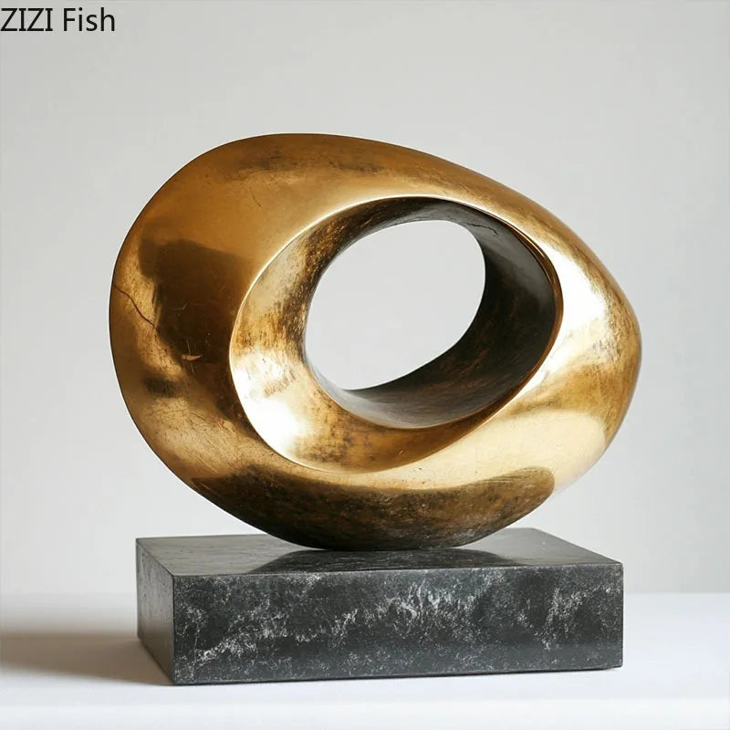sculptures abstraites modernes métal doré surface texturée or noir minimaliste