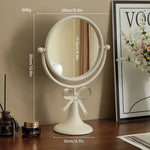 miroir table rotatif or noir rose poudré élégant vintage rubans crèmes aromathérapie
