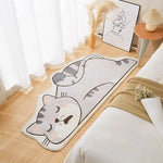 Tapis de sol gris clair en forme de chaton stylisé, avec un design moderne et minimaliste, décorant un intérieur lumineux et épuré.