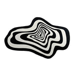 tapis noir blanc moderne abstrait rayures concentriques effet ondulé salon intérieur