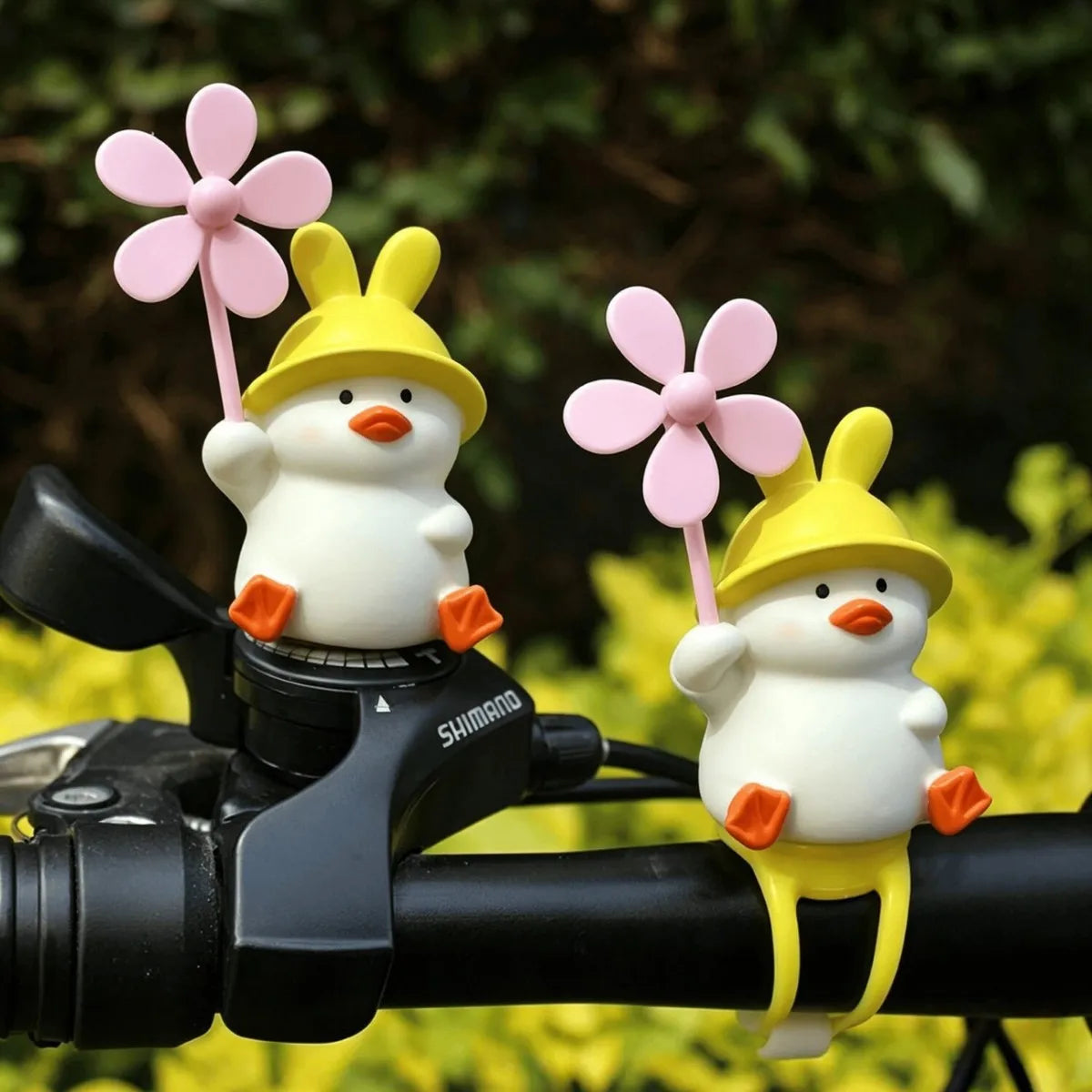 jouet canard jaune oreilles lapin moulin vent rose clip fixation guidon vélo enfantin