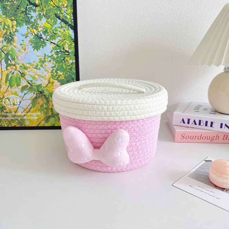 panier rangement rose blanc rayures horizontales noeud décoratif réutilisable polyestère enfantin cordelette organisation jouets
