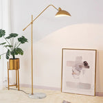 lampadaire sol moderne noir base marbre ajustable métal doré salon intérieur luxe