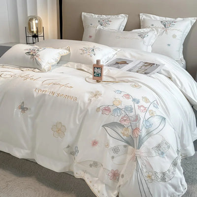Parure de lit gaze en coton égyptien brodée fleurs chic sur un lit
