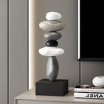 Sculpture moderne résine blanche gris noir lisse inspiration naturelle minimaliste base carrée noire