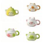 théière forme chat blanc orange rose visage mignon oreilles pointues taches oranges decorative cartoonish