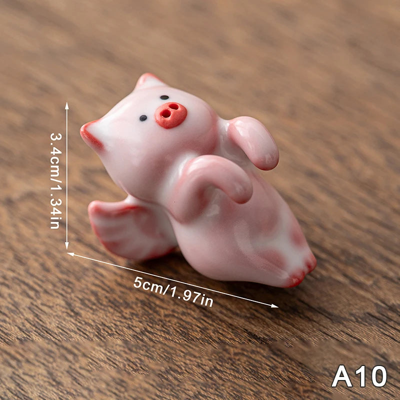 bol thé décoratif motifs fleurs pois rose blanc figurines porc céramique artisanal