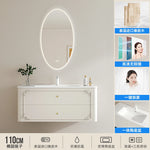meuble salle bain noir blanc tiroirs vasque ornements dorés classique fixations murales accessoires cosmétiques