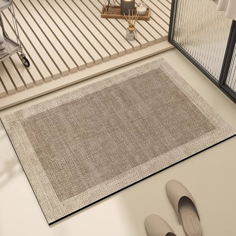 Un tapis gris clair et texturé, reposant sur un sol en bois clair, crée une ambiance relaxante et épurée dans cette pièce moderne et élégante.