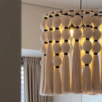 Suspension lumineuse moderne franges chaînes métalliques beige noir