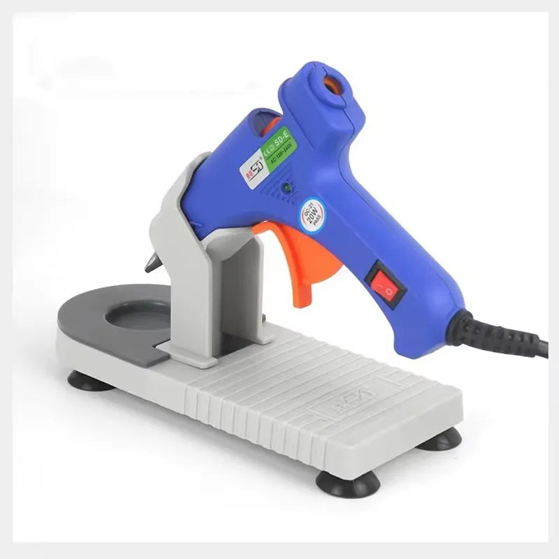support pistolet colle chaude réutilisable gris bleu orange texturé industriel pieds stabilisation cordon électrique
