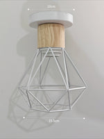 suspension lumineuse industrielle cage métal finition bois naturel ampoule filament noir moderne