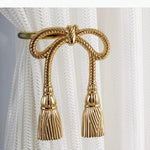 boucles rideau or ailes sculptées classiques décoratives noels dorés deux pièces