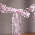 guirlande décorative festives rose noeuds tissu texturé semi transparent mariage anniversaire fille préparation naissance
