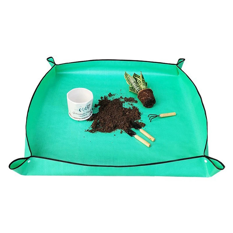 tapis pliable protection plantes utilitaire jardinage vert turquoise outils terreau pots feuilles rouges