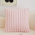 coussins rectangulaires peluche douce rose clair vert pastel lit tissé rayures horizontales moderne respectueux