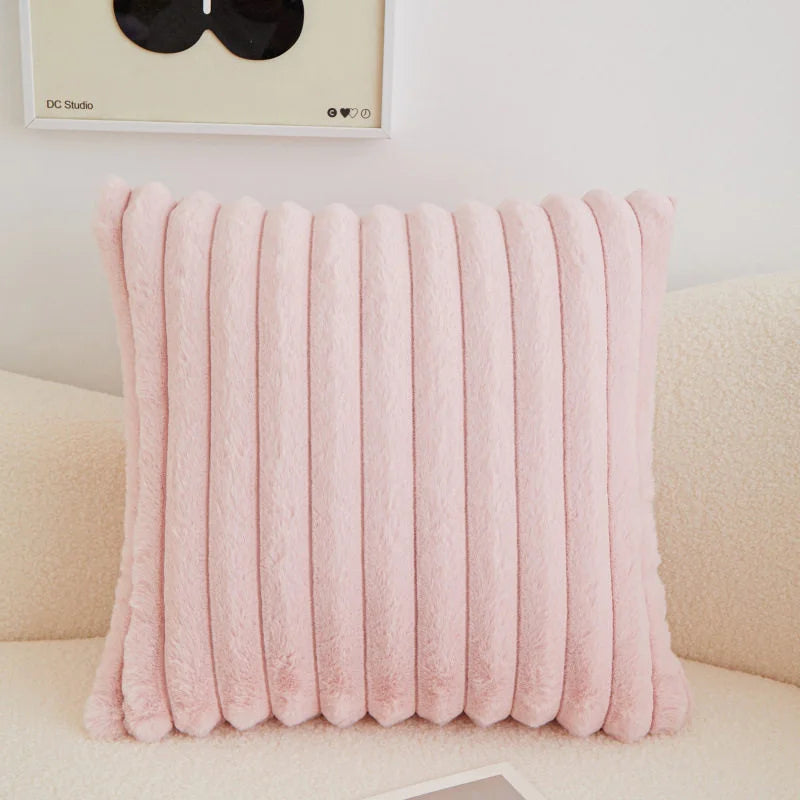 coussins rectangulaires peluche douce rose clair vert pastel lit tissé rayures horizontales moderne respectueux
