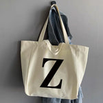 sac main femme toile beige clair lettre noire poignées détachables