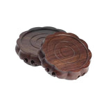 support décoration bois marron foncé texture naturelle gravure circulaire classique artisanal théière vase boule