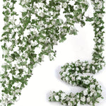 guirlande fleurs artificielles roses blanches feuilles vertes décoration extérieure mariage romantique