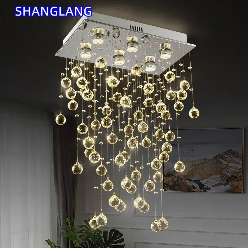 suspension lumineuse moderne transparente cristal brillantes élégante dorée fixations invisibles chaînes incluses