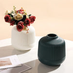 vases modernes orange blanc vert rayures horizontales opaques décoration intérieure papier bougie fleurs artificielles