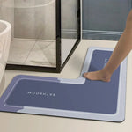 tapis antidérapant moderne minimaliste motif pieds salle bain bleu foncé gris blanc absorbant