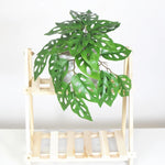 plantes artificielles vertes feuilles perforées modernes décoration intérieure pot tropical